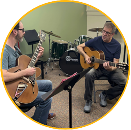 Teenage guitar player smiling